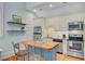 Well-lit kitchen features stainless steel appliances and butcher block island at 62 Eastlake Rd, Mount Pleasant, SC 29464