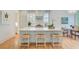 Bright kitchen with a large island, white countertops, and charming straw-seated stools at 62 Eastlake Rd, Mount Pleasant, SC 29464