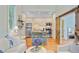 Bright living room and kitchen featuring stainless steel appliances, hardwood floors, and barn door at 62 Eastlake Rd, Mount Pleasant, SC 29464