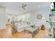 Open concept living room that flows seamlessly to the kitchen with hardwood floors and natural light at 62 Eastlake Rd, Mount Pleasant, SC 29464