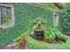 Detailed view of the water feature, showcasing lush foliage and brick accents at 62 Eastlake Rd, Mount Pleasant, SC 29464