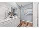 Elegant bathroom featuring a double vanity, modern fixtures, and wood-look flooring at 722 Meadowbrook Ln, Summerville, SC 29486