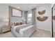 Serene main bedroom featuring a plush bed, stylish decor, and soft, natural lighting for a relaxing retreat at 722 Meadowbrook Ln, Summerville, SC 29486
