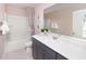 Stylish bathroom with combined tub and shower, modern vanity, and chic decor elements at 724 Meadowbrook Ln, Summerville, SC 29486