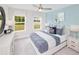 Serene bedroom with two large windows, neutral decor and an inviting cozy bed at 724 Meadowbrook Ln, Summerville, SC 29486