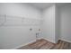 Walk-in closet with wood-look flooring and wire shelving at 778 Meadowbrook Ln, Summerville, SC 29486