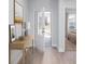 Inviting entryway with light wood floors, leading into a bedroom with an open door and natural light at 778 Meadowbrook Ln, Summerville, SC 29486