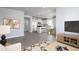 Open-concept space with a kitchen, dining area, and living room, all with stylish decor at 778 Meadowbrook Ln, Summerville, SC 29486