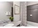 Beautiful bathroom featuring a granite countertop, framed art, and stylish tile work at 780 Meadowbrook Lane, Summerville, SC 29486