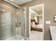 Modern bathroom featuring a glass-enclosed shower and a view into the adjacent bedroom at 780 Meadowbrook Lane, Summerville, SC 29486