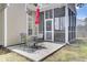 Back patio featuring a table, chairs, and red umbrella at 8612 Hickory Creek Ln, North Charleston, SC 29420