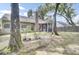 Large backyard with a screened in porch and mature trees at 8612 Hickory Creek Ln, North Charleston, SC 29420