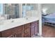 Bathroom featuring a double vanity with lots of cabinets and large mirrors at 8612 Hickory Creek Ln, North Charleston, SC 29420