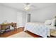 Well-lit bedroom featuring hardwood floors and a white ceiling at 8612 Hickory Creek Ln, North Charleston, SC 29420