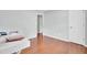 A bright bedroom featuring hardwood floors and white trim at 8612 Hickory Creek Ln, North Charleston, SC 29420