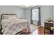 Bedroom featuring a brass bed frame and natural light at 8612 Hickory Creek Ln, North Charleston, SC 29420