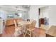 Open concept dining area with hardwood floors and views of the living room and kitchen at 8612 Hickory Creek Ln, North Charleston, SC 29420