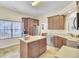 Bright kitchen with a central island, stainless steel appliances, and light countertops at 8612 Hickory Creek Ln, North Charleston, SC 29420