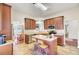 Modern kitchen with stainless steel appliances, wood cabinetry, and a breakfast nook at 8612 Hickory Creek Ln, North Charleston, SC 29420