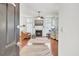 Bright living room featuring a fireplace, hardwood floors, and abundant natural light at 8612 Hickory Creek Ln, North Charleston, SC 29420