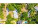 An aerial view of a single story home nestled among lush trees in a quiet neighborhood at 881 Evans Rd, Charleston, SC 29412