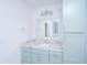 Bright bathroom vanity with marble countertops and chrome fixtures under decorative lighting at 881 Evans Rd, Charleston, SC 29412