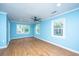 Spacious bedroom featuring three windows and a ceiling fan at 881 Evans Rd, Charleston, SC 29412