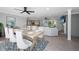 Open concept features a large dining table and living area with modern decor at 881 Evans Rd, Charleston, SC 29412
