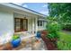 Inviting front entrance features double doors, a stone walkway, and decorative blue planters at 881 Evans Rd, Charleston, SC 29412