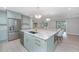 Spacious kitchen features a large island with granite countertops and stainless steel appliances at 881 Evans Rd, Charleston, SC 29412