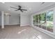 Bright living area with large windows, hardwood floors, and neutral wall color at 881 Evans Rd, Charleston, SC 29412