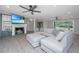 Stylish living room with fireplace, large sectional, and modern ceiling fans at 881 Evans Rd, Charleston, SC 29412