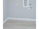 Empty room with light gray walls and modern vinyl flooring; ready for customization at 881 Evans Rd, Charleston, SC 29412