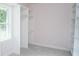 Empty walk-in closet featuring built-in shelving, neutral paint, and large windows at 881 Evans Rd, Charleston, SC 29412