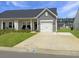 Attractive single story home with a well-manicured lawn and a one car garage at 953 Dusk Dr, Summerville, SC 29486
