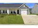 Charming home with a well-manicured lawn and an attached garage at 953 Dusk Dr, Summerville, SC 29486