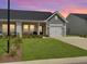 Charming single story home with a well-manicured lawn and a one car garage at 953 Dusk Dr, Summerville, SC 29486