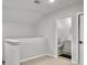 Upstairs hallway features neutral carpet, white walls, and bathroom with a shower visible through the doorway at 953 Dusk Dr, Summerville, SC 29486