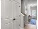 Hallway with wood floors, a blue rug, and white doors leading to other rooms of the house at 953 Dusk Dr, Summerville, SC 29486