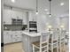 Modern kitchen featuring an island with barstool seating, quartz countertops, and pendant lights at 953 Dusk Dr, Summerville, SC 29486