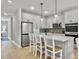Well-equipped kitchen featuring stainless steel appliances and an island with barstool seating at 953 Dusk Dr, Summerville, SC 29486