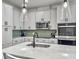 Beautiful kitchen island with quartz countertop, modern faucet, and pendant lighting at 953 Dusk Dr, Summerville, SC 29486
