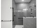 Sleek walk-in shower featuring gray subway tiles, modern fixtures, and a glass enclosure for a clean, contemporary look at 953 Dusk Dr, Summerville, SC 29486
