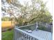 View of a serene deck featuring a chiminea and quaint seating, overlooking a lush, natural landscape at 1050 Marsh Court Ln, Mount Pleasant, SC 29464