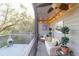 The screened-in deck is perfect for relaxing with comfortable wicker furniture and overhead string lights at 1050 Marsh Court Ln, Mount Pleasant, SC 29464