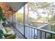 The screened-in deck provides an outdoor seating area with trees, railings, and decorative features at 1050 Marsh Court Ln, Mount Pleasant, SC 29464