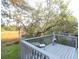 View of a serene deck featuring a chiminea and quaint seating, overlooking a lush, natural landscape at 1050 Marsh Court Ln, Mount Pleasant, SC 29464