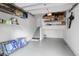 Organized garage space featuring ample storage shelves and a convenient staircase at 1050 Marsh Court Ln, Mount Pleasant, SC 29464