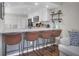 Modern kitchen with white cabinets, stainless steel appliances, and stylish bar seating at 1050 Marsh Court Ln, Mount Pleasant, SC 29464