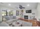 Cozy living room with fireplace, ceiling fan, and access to deck at 1050 Marsh Court Ln, Mount Pleasant, SC 29464